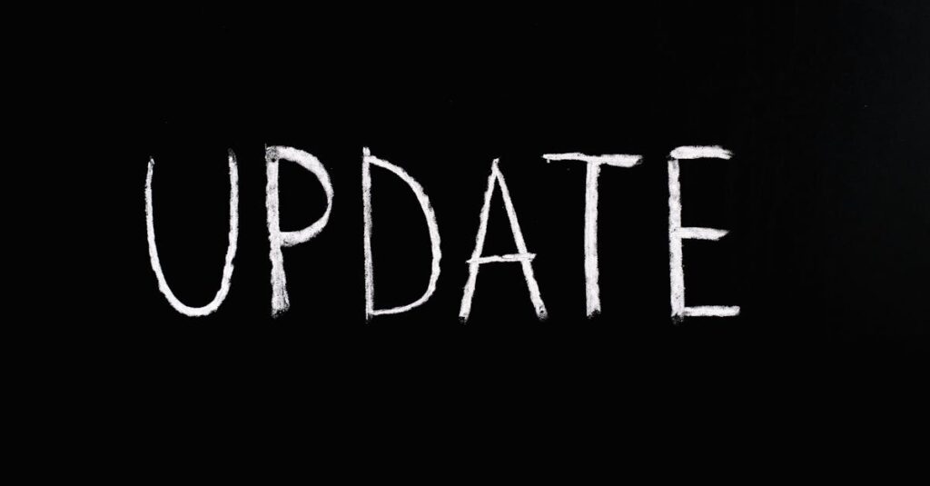 Bold 'UPDATE' text written in chalk on a blackboard. Perfect for concepts of change and communication.